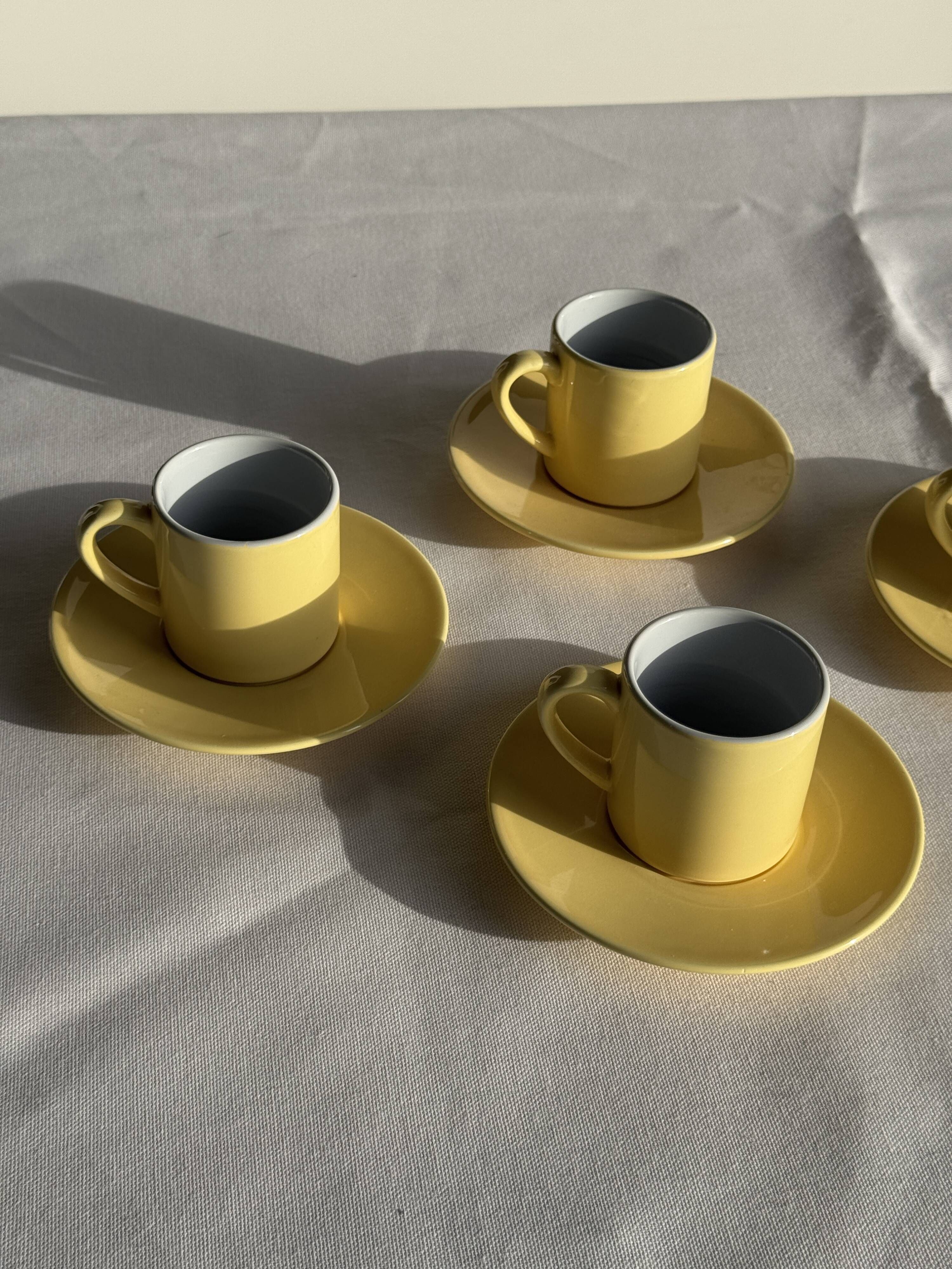 Set of 4 vintage yellow Italian espresso cups and saucers.