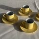 Set of 4 vintage yellow Italian espresso cups and saucers.