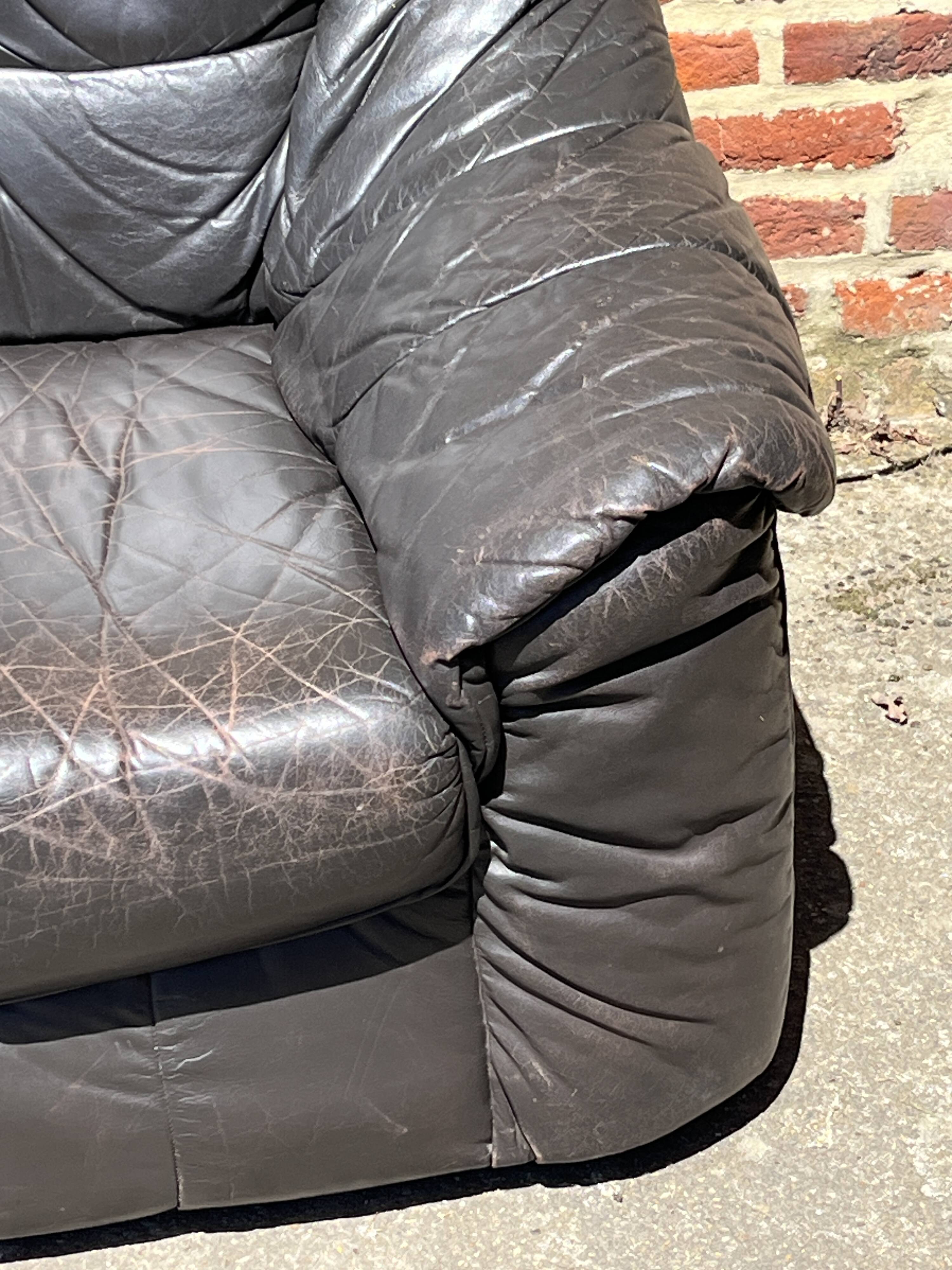 Pair of patinated leather club armchairs