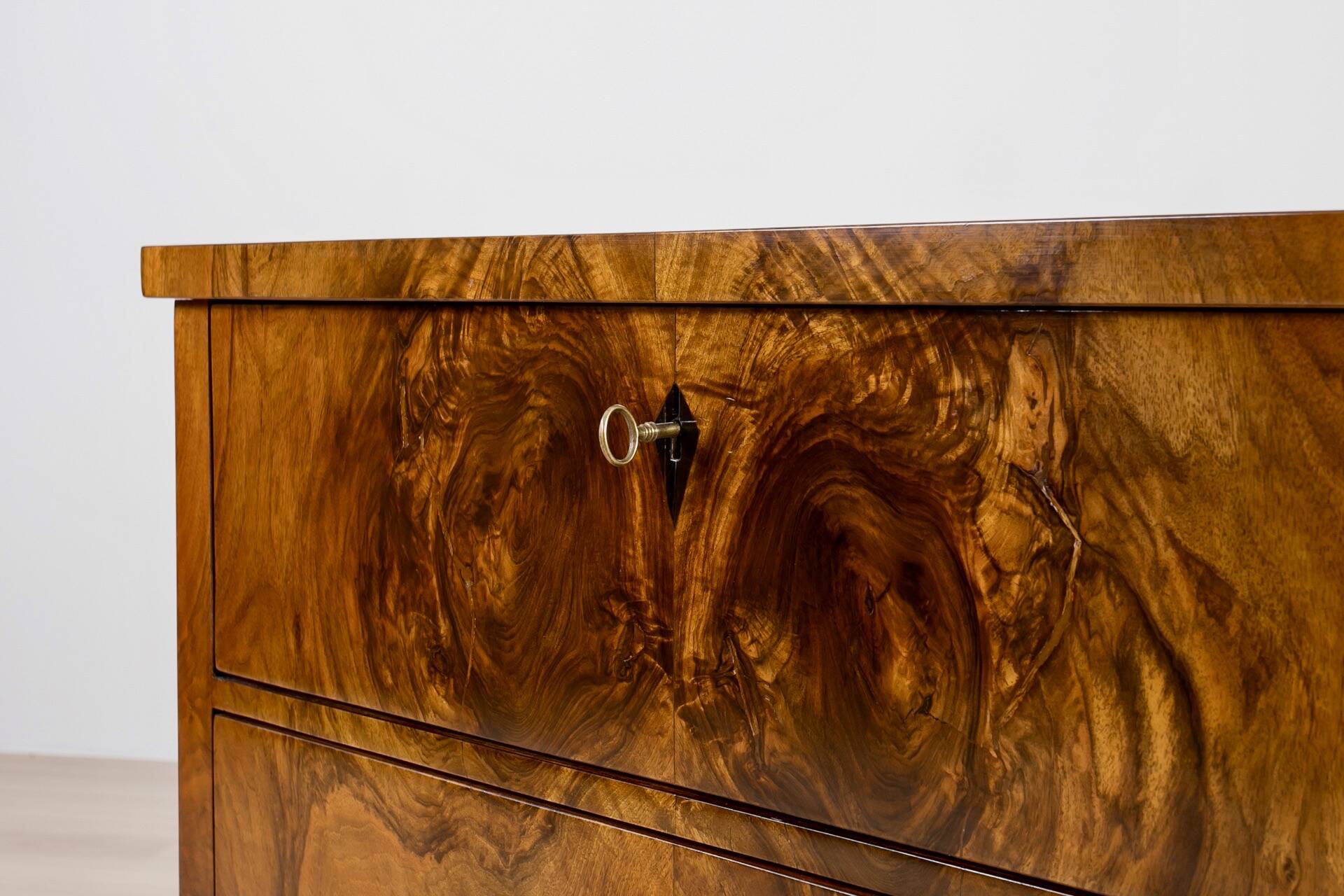 Elegant pair of Biedermeier style walnut commodes, Germany, French polish.