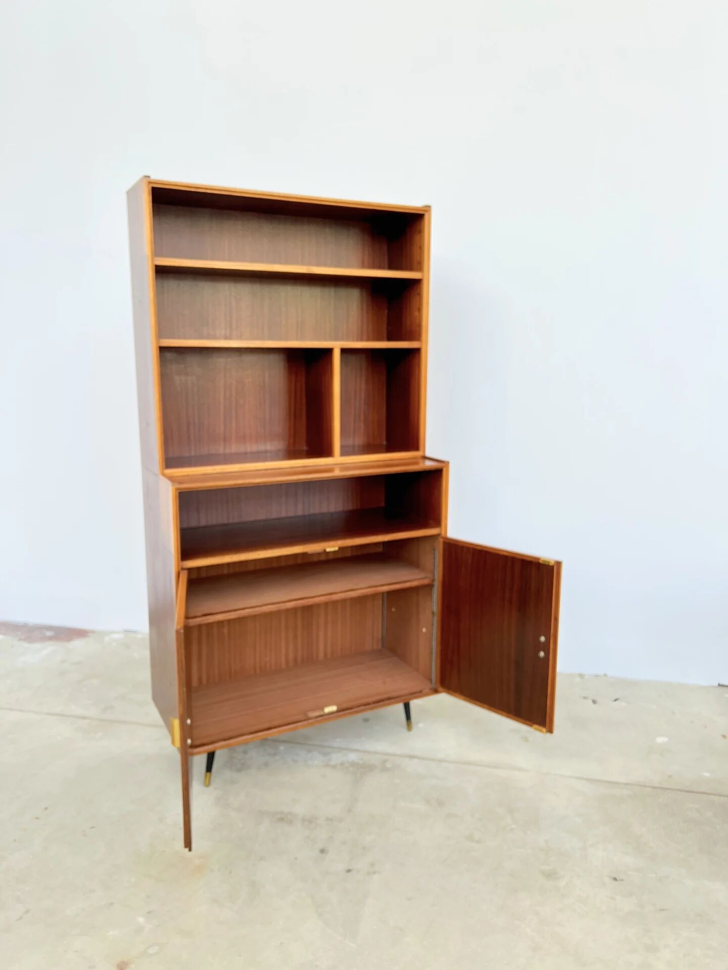 Mahogany library — closed storage and open cubbies, custom-made, 1960s.