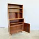 Mahogany library — closed storage and open cubbies, custom-made, 1960s.