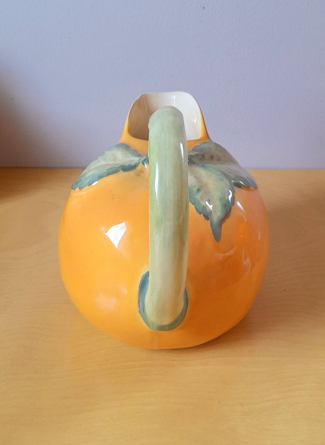 Orange pitcher in slip