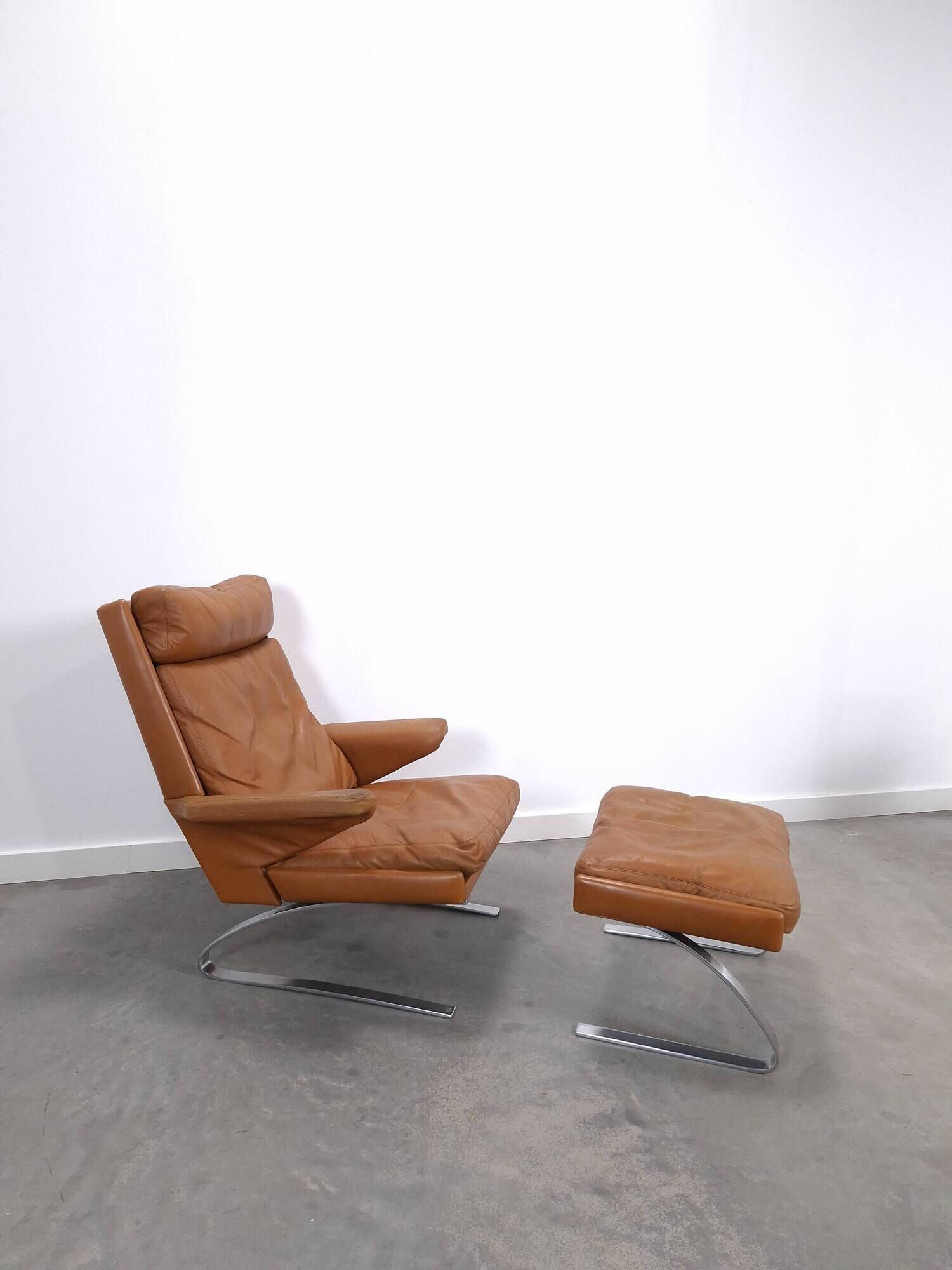 Vintage COR Swing armchair with ottoman, Reinhold Adolf, cognac leather