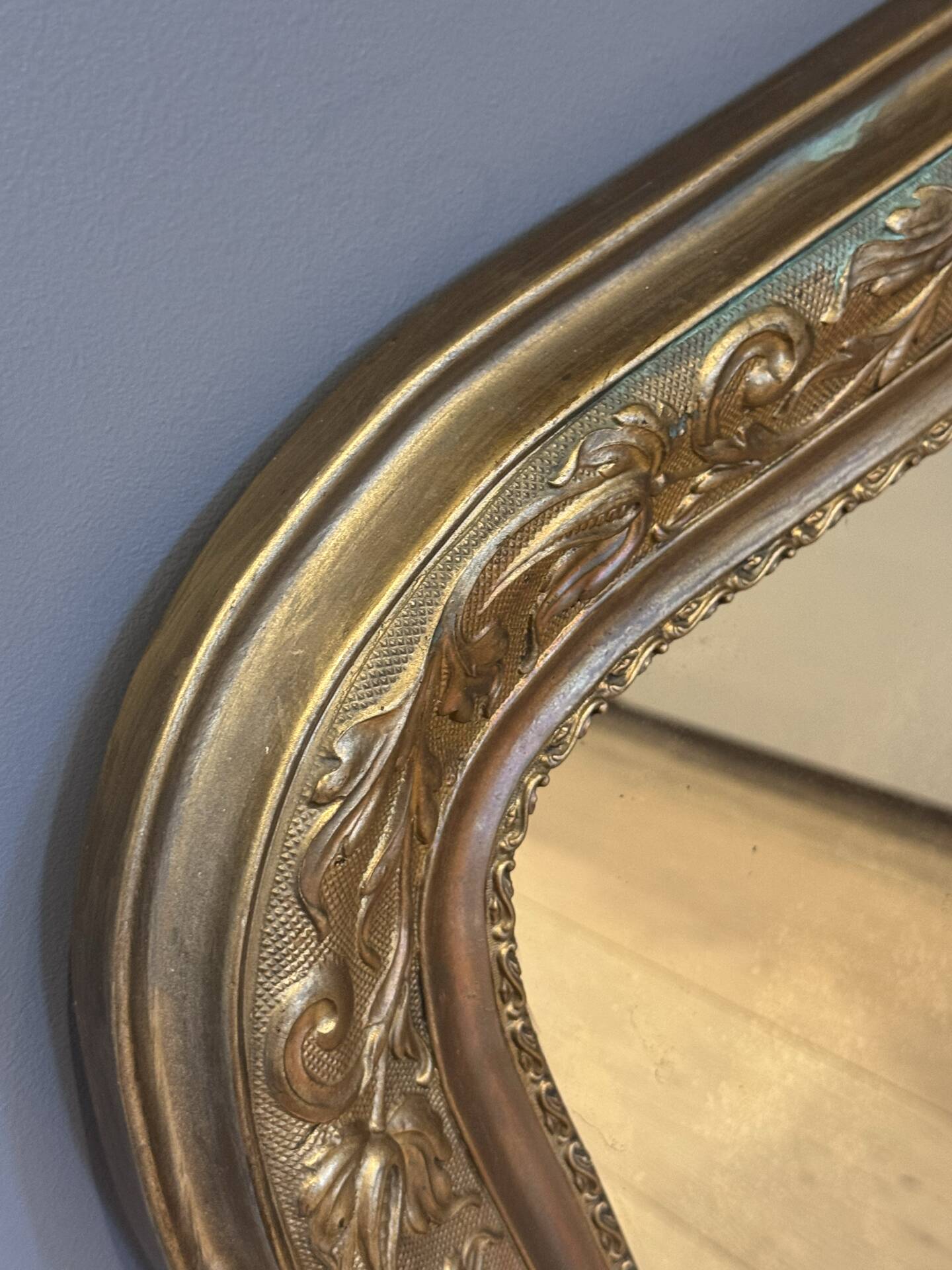 Golden mirror with mouldings