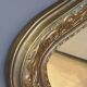 Golden mirror with mouldings