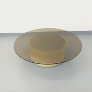 Vintage round coffee table in glass, leather, and metal in Space Age style from the 70s.
