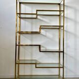 Old shelf in golden metal brass geometric library design 80s vintage