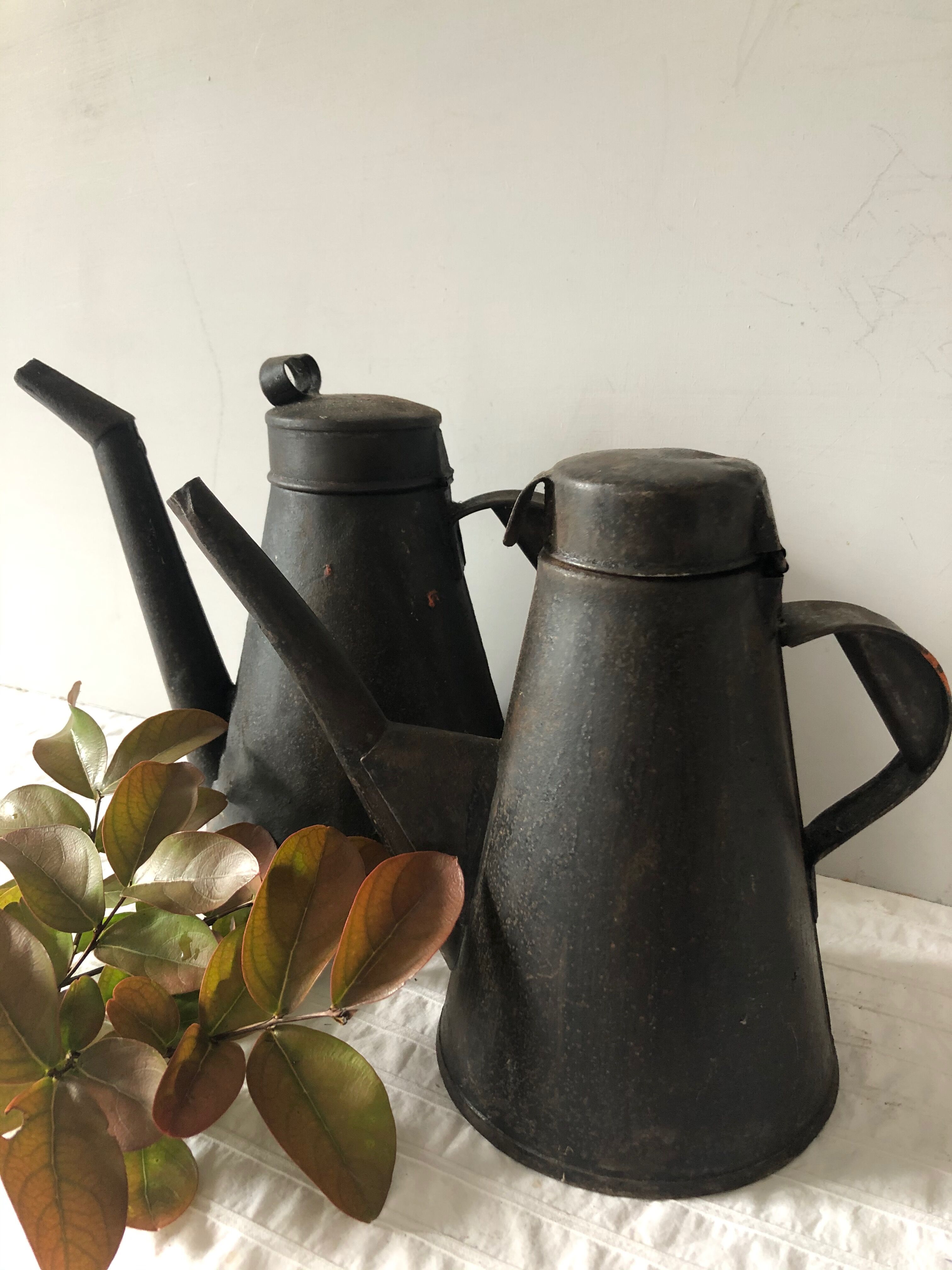 Two workshop burettes, indoor watering cans