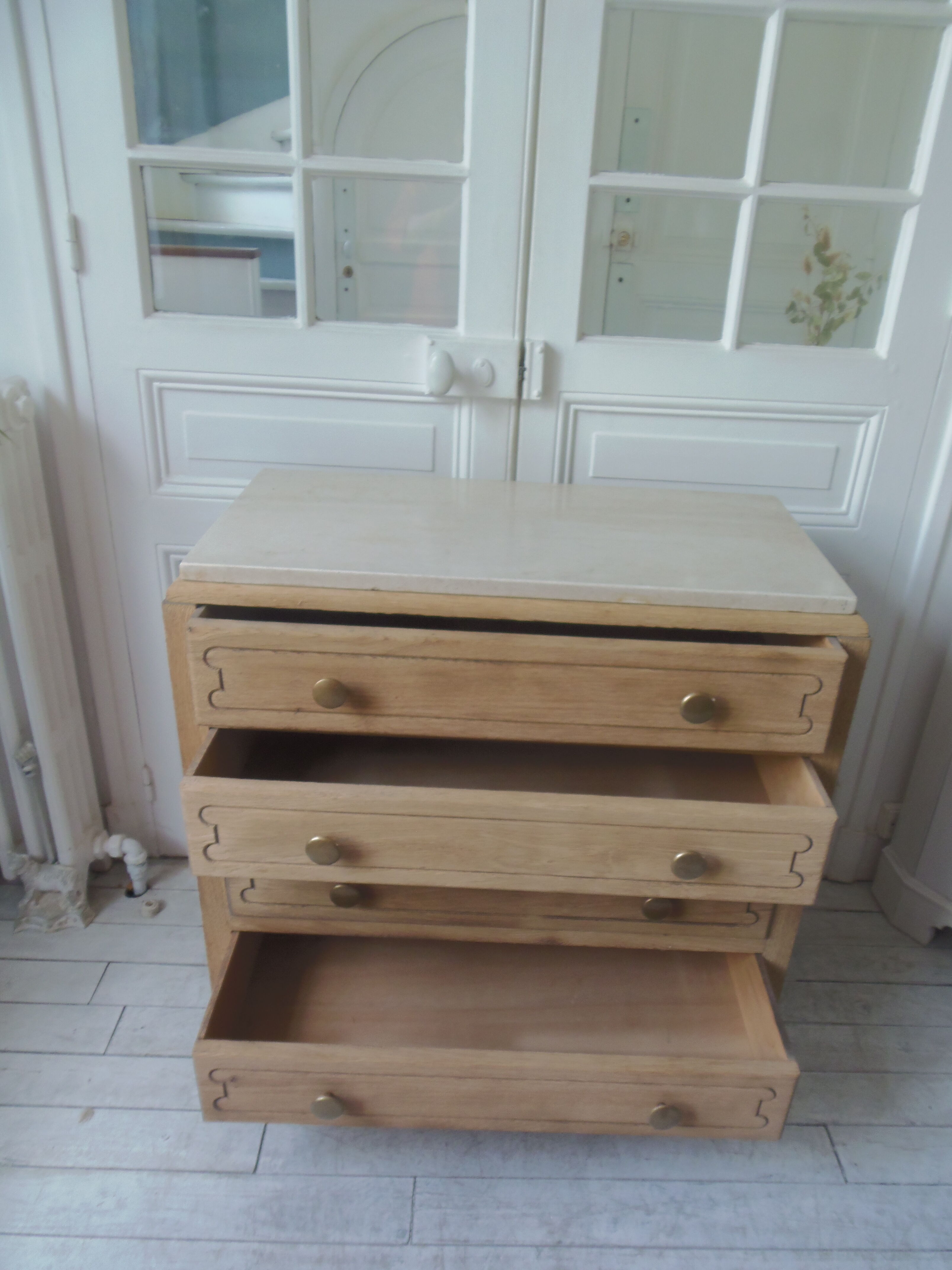 Vintage oak chest of drawers, a travertine plate laid for tray.