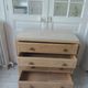 Vintage oak chest of drawers, a travertine plate laid for tray.