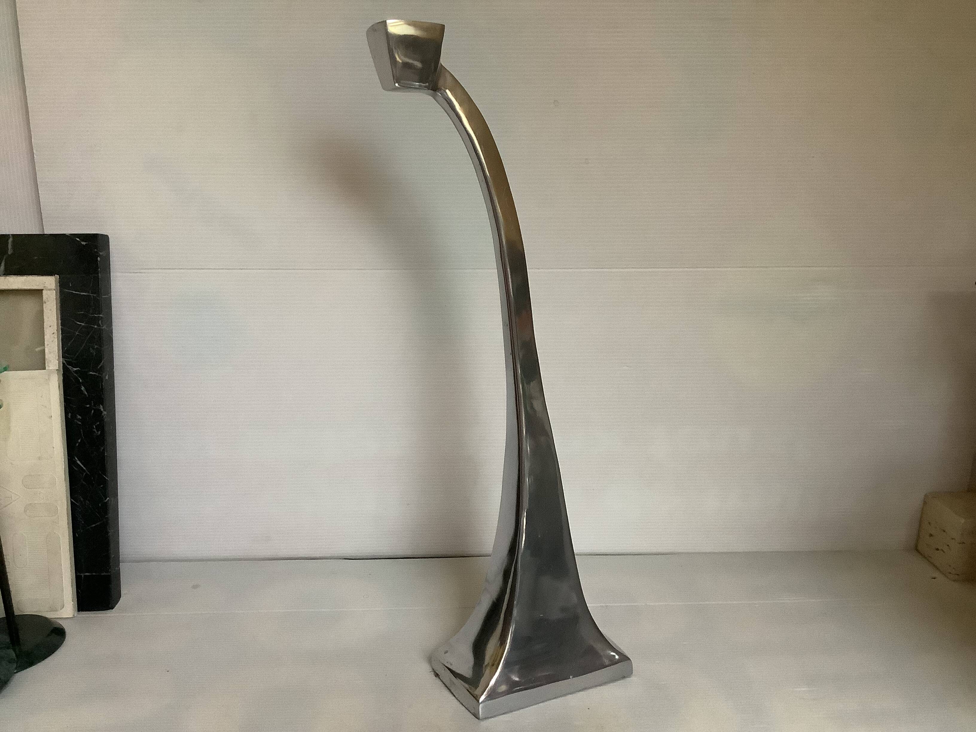 Large silver metal candlestick in the style of Xavier Lust