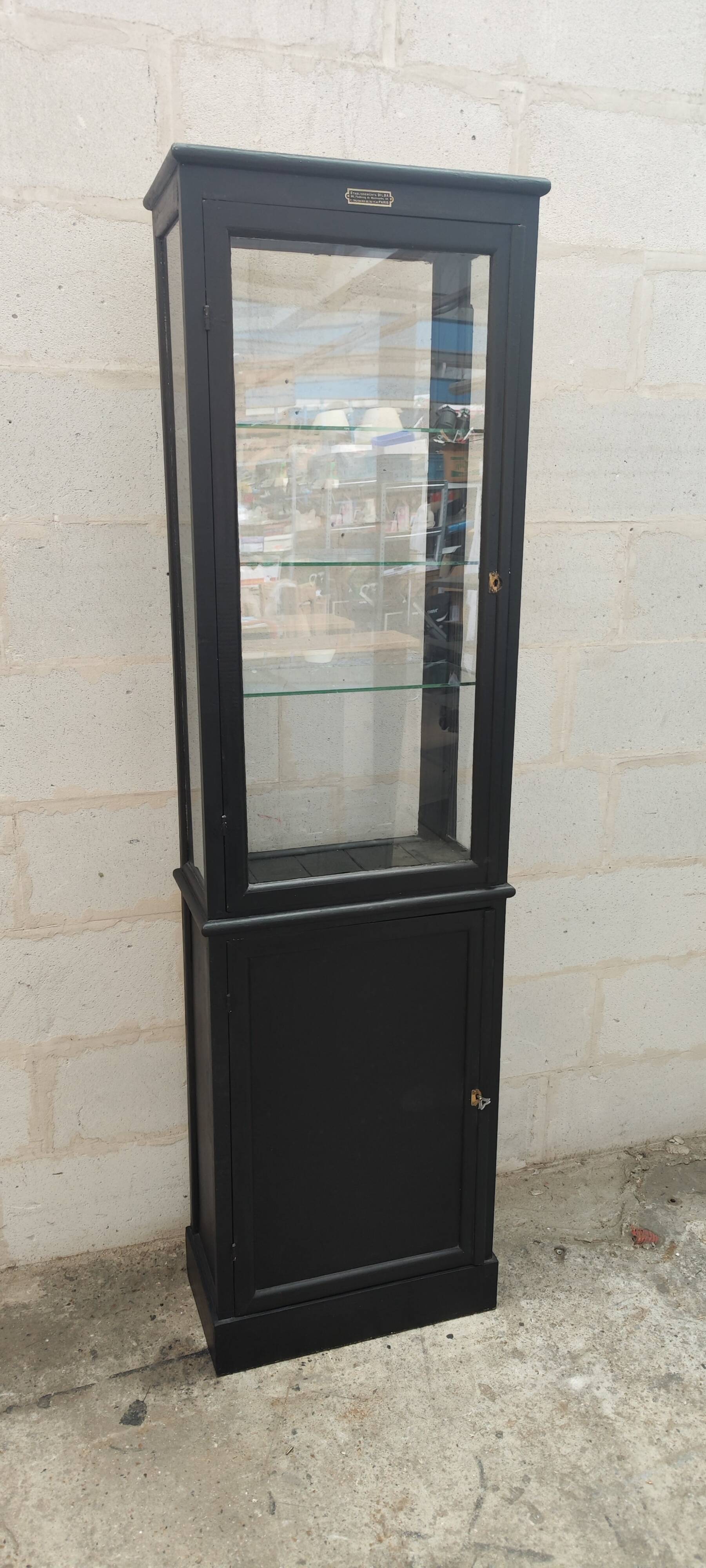 Old two-door shop showcase with black patina