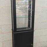 Old two-door shop showcase with black patina