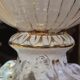 Italian coffee table with glass top, wooden base, and porcelain legs