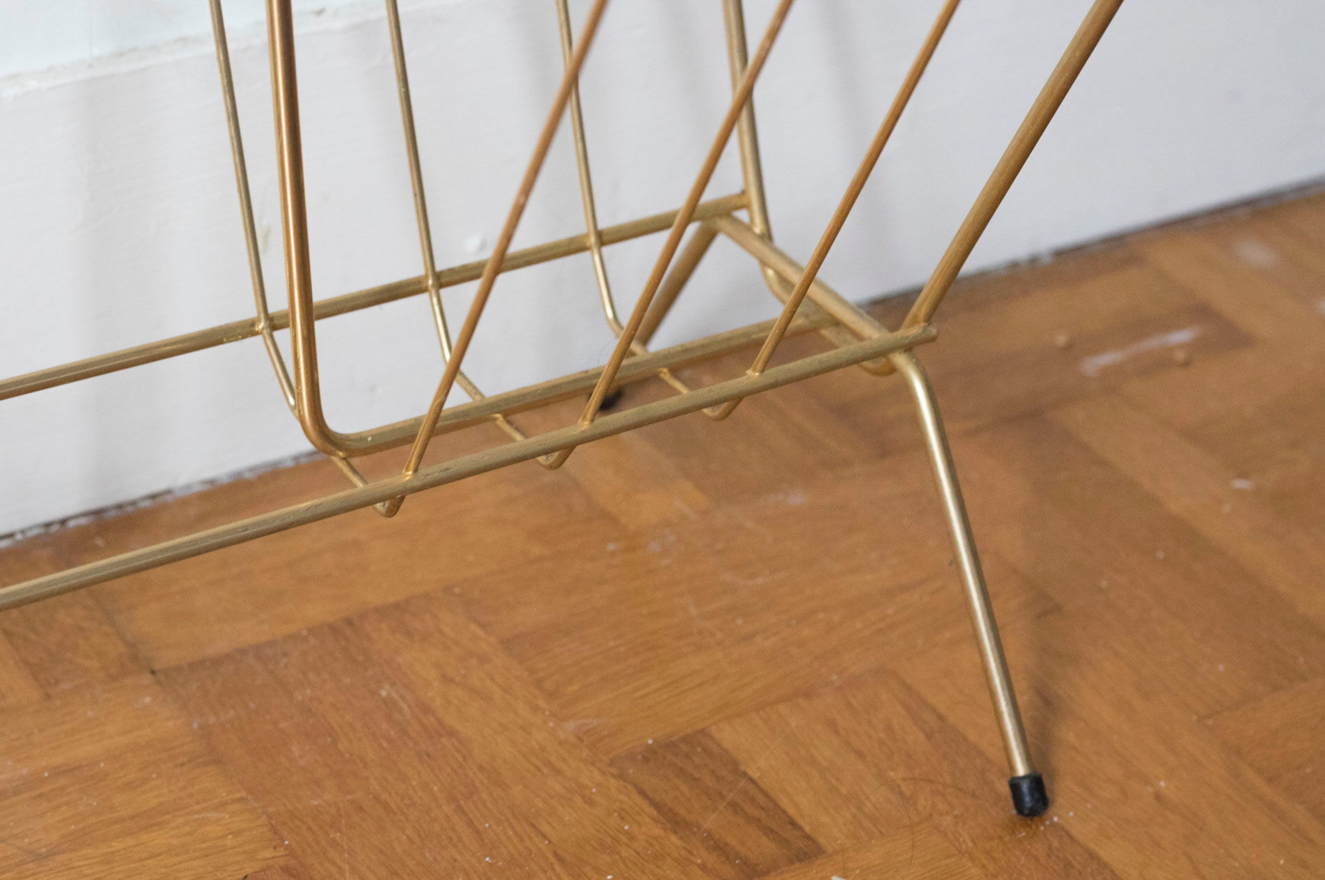 Vintage magazine holder in gold metal