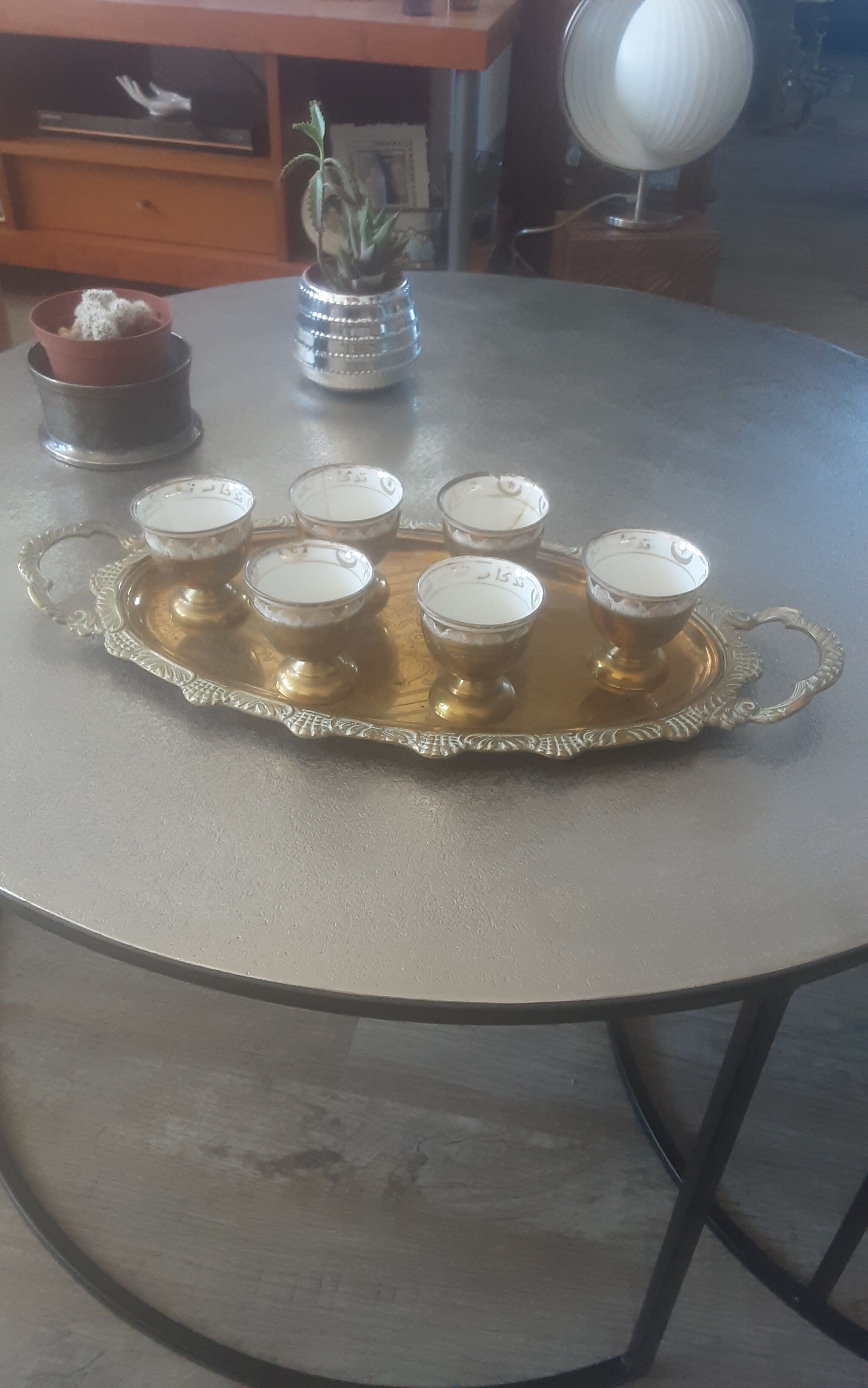 Old service porcelain brass cups