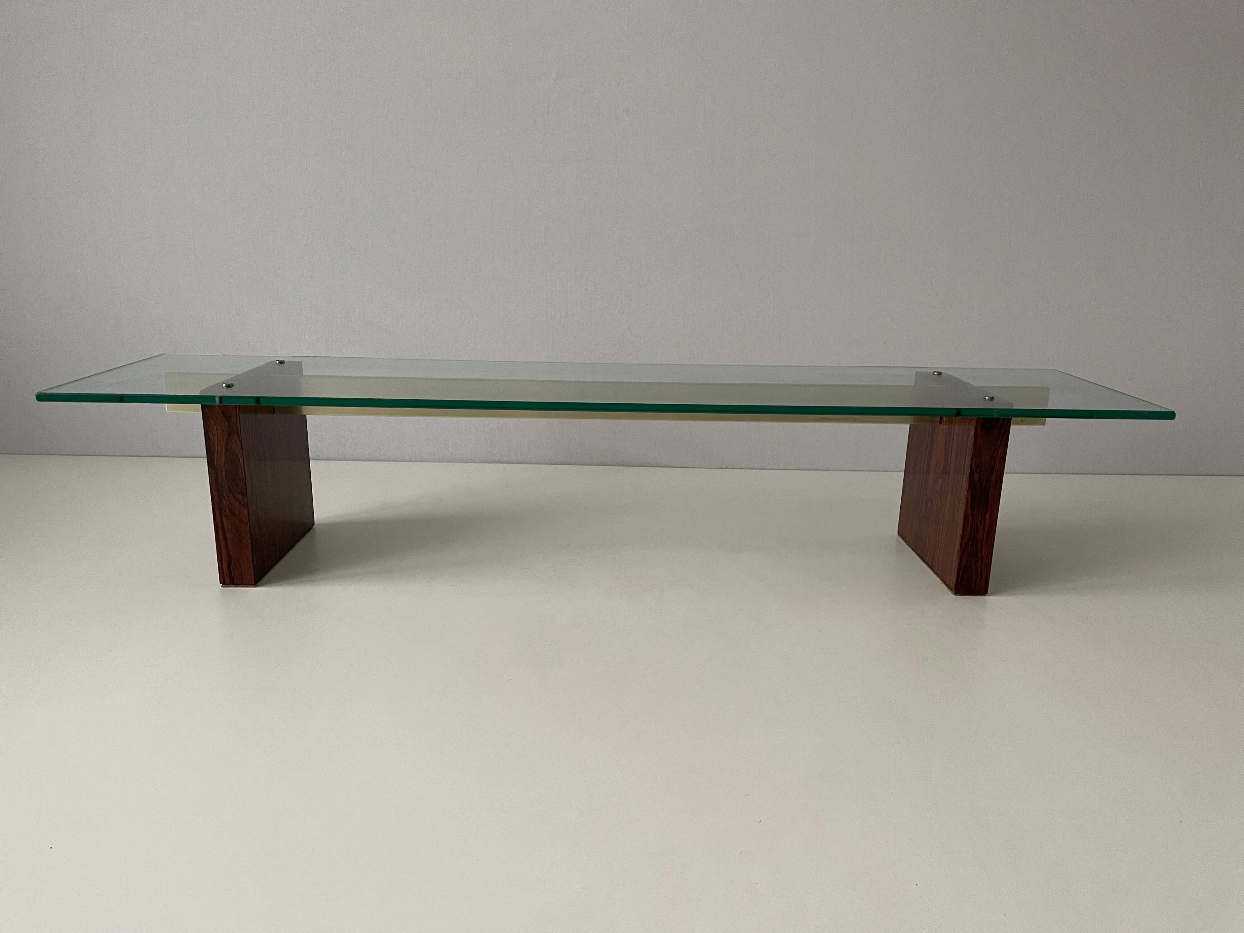 Mid-century minimalist thick glass coffee table, rosewood legs, 1960, Germany.