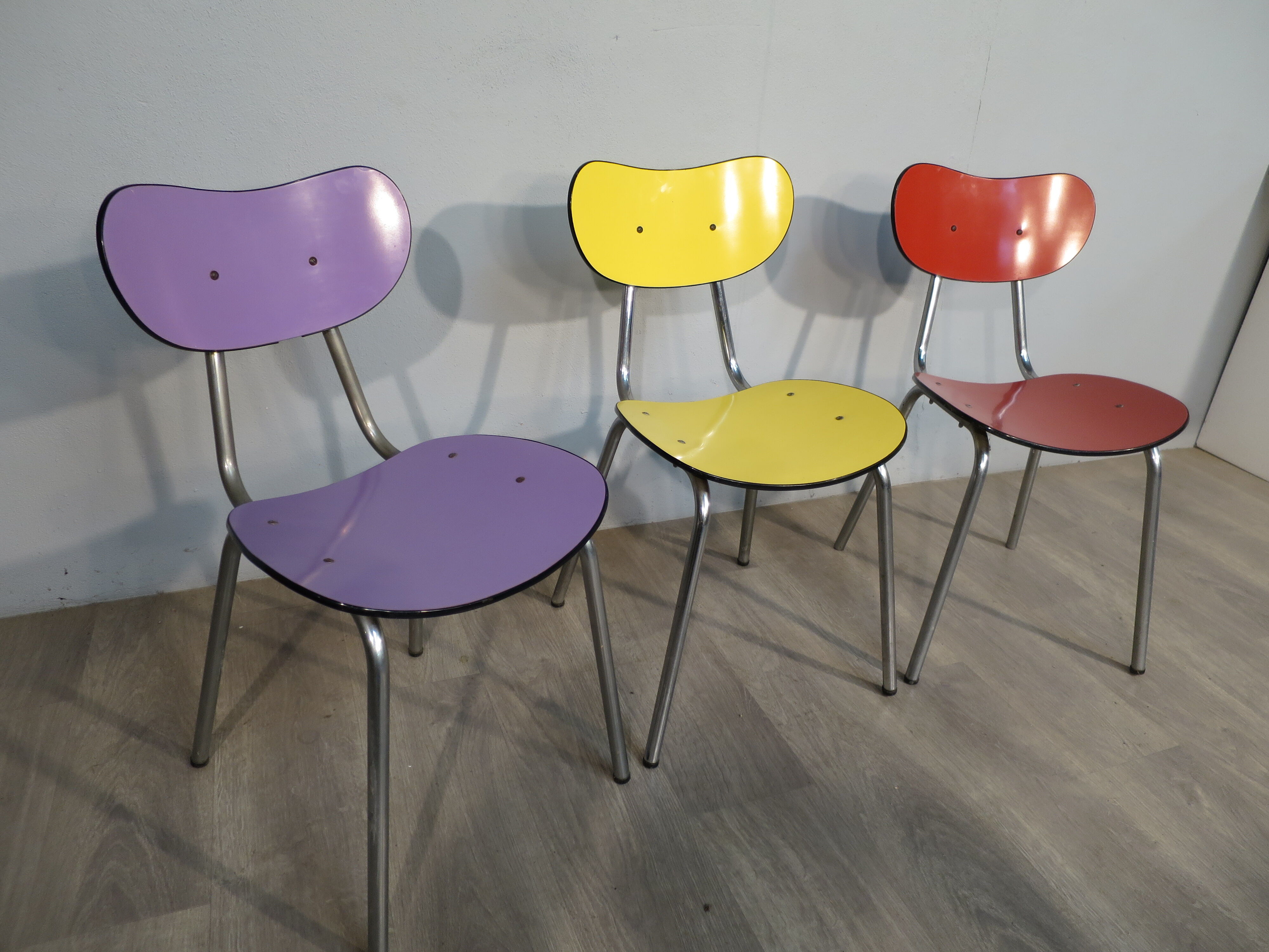 3 colored formica chairs