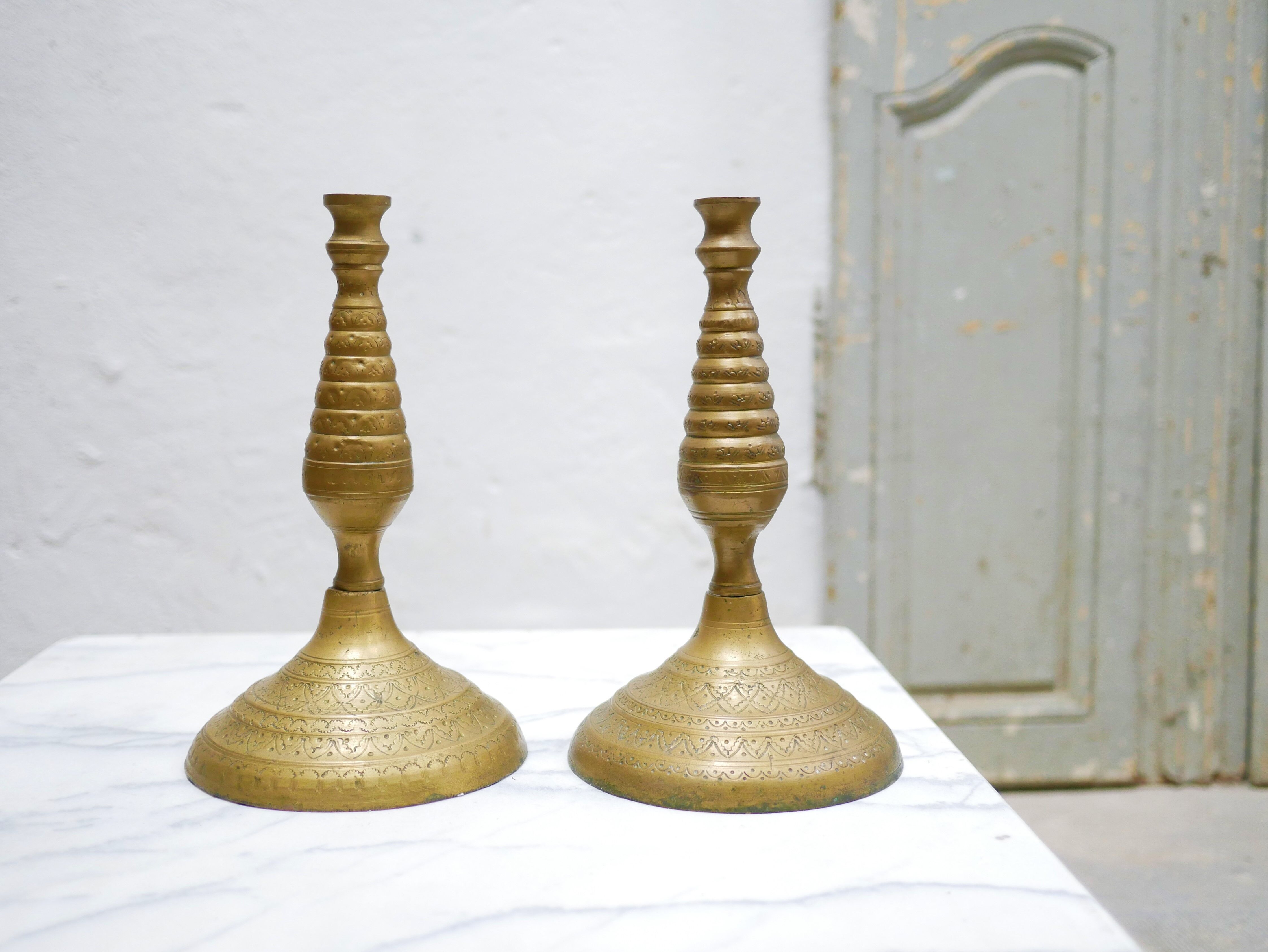 Pair of vintage candle holders in golden brass
