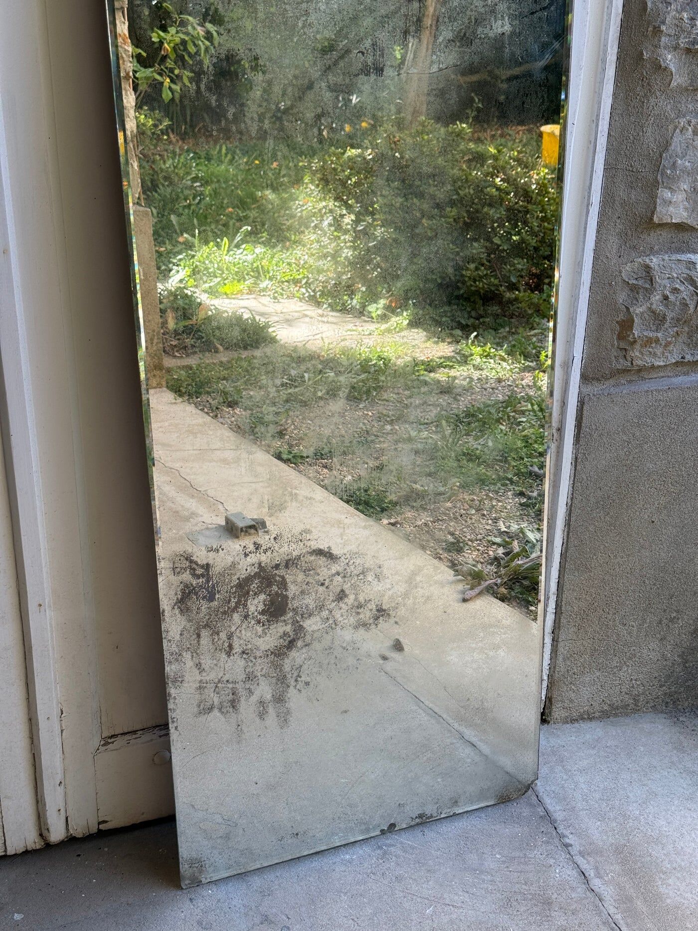 Large vintage mirror with bevelled glass.