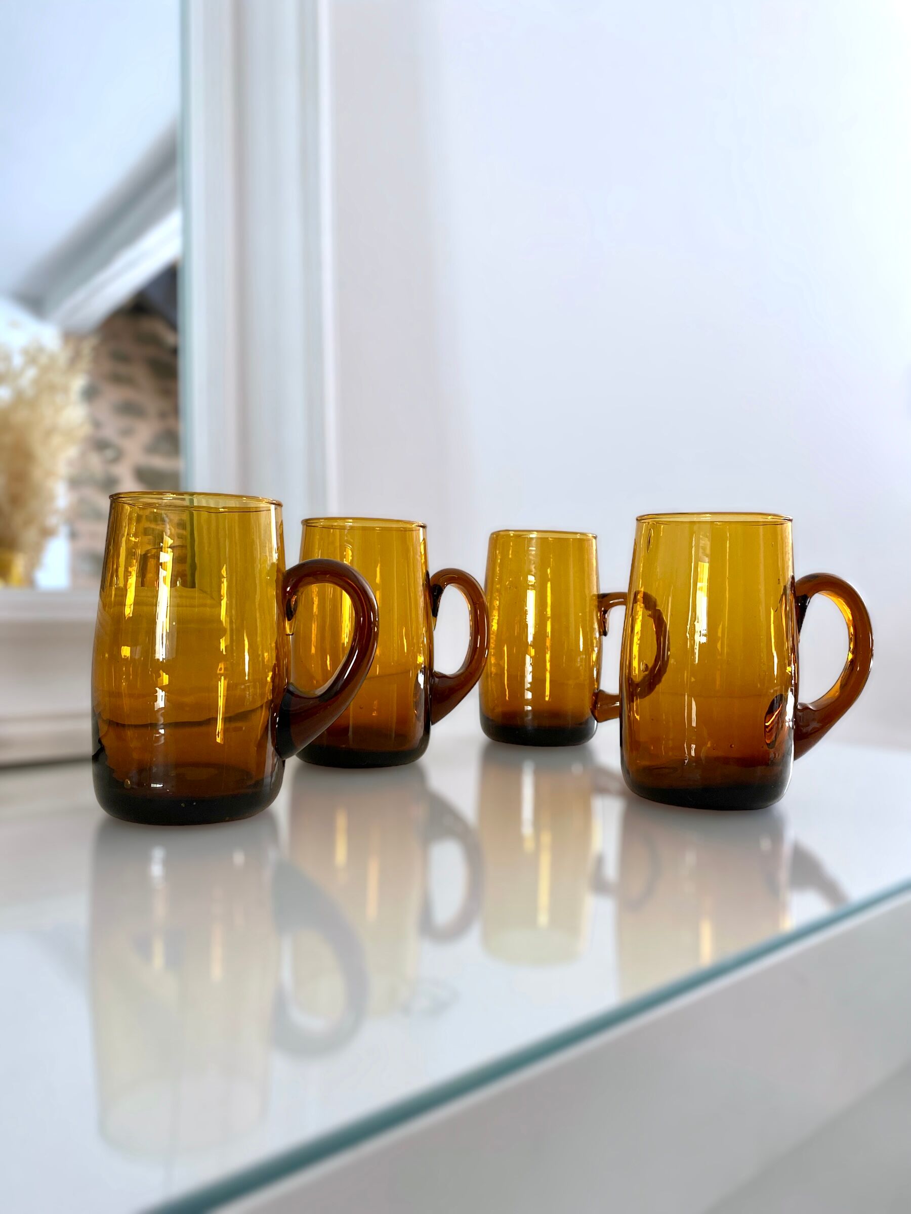 4 mugs/ mugs in vintage blown amber glass