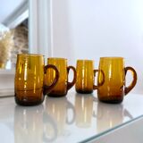 4 mugs/ mugs in vintage blown amber glass