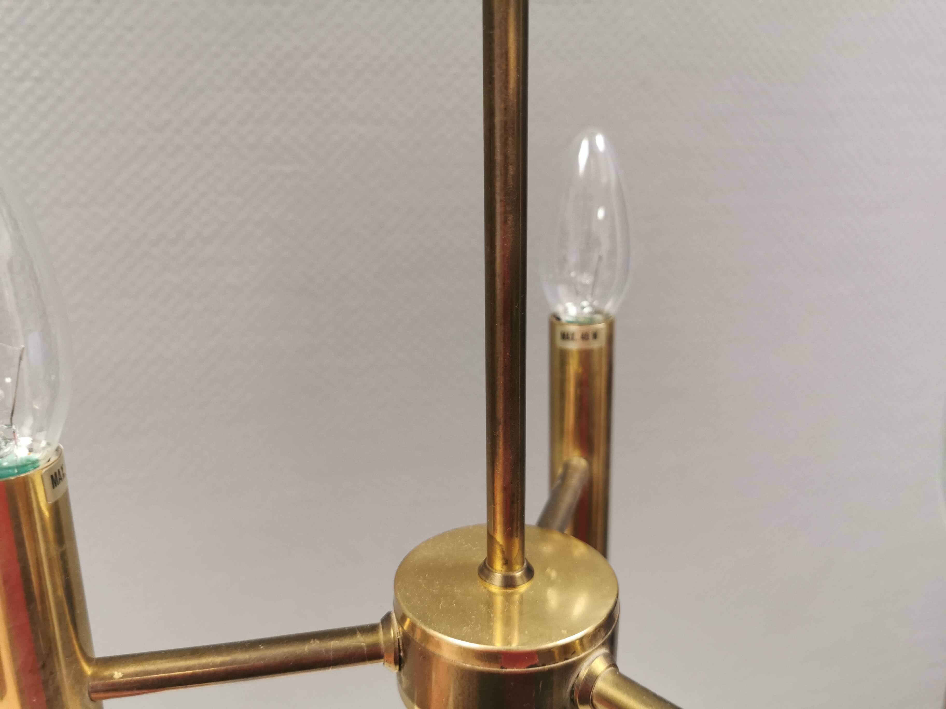 Chandelier with 3 light sources, made of metal and brass. 1960-70s