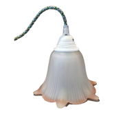 Opaque glass tulip with a pink rim and green cable.