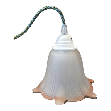 Opaque glass tulip with a pink rim and green cable.