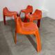 Table and 4 chairs in orange fiberglass design from the 70s Patrick Gingembre Paulus edition