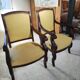 2 antique matching armchairs in wood and fabric