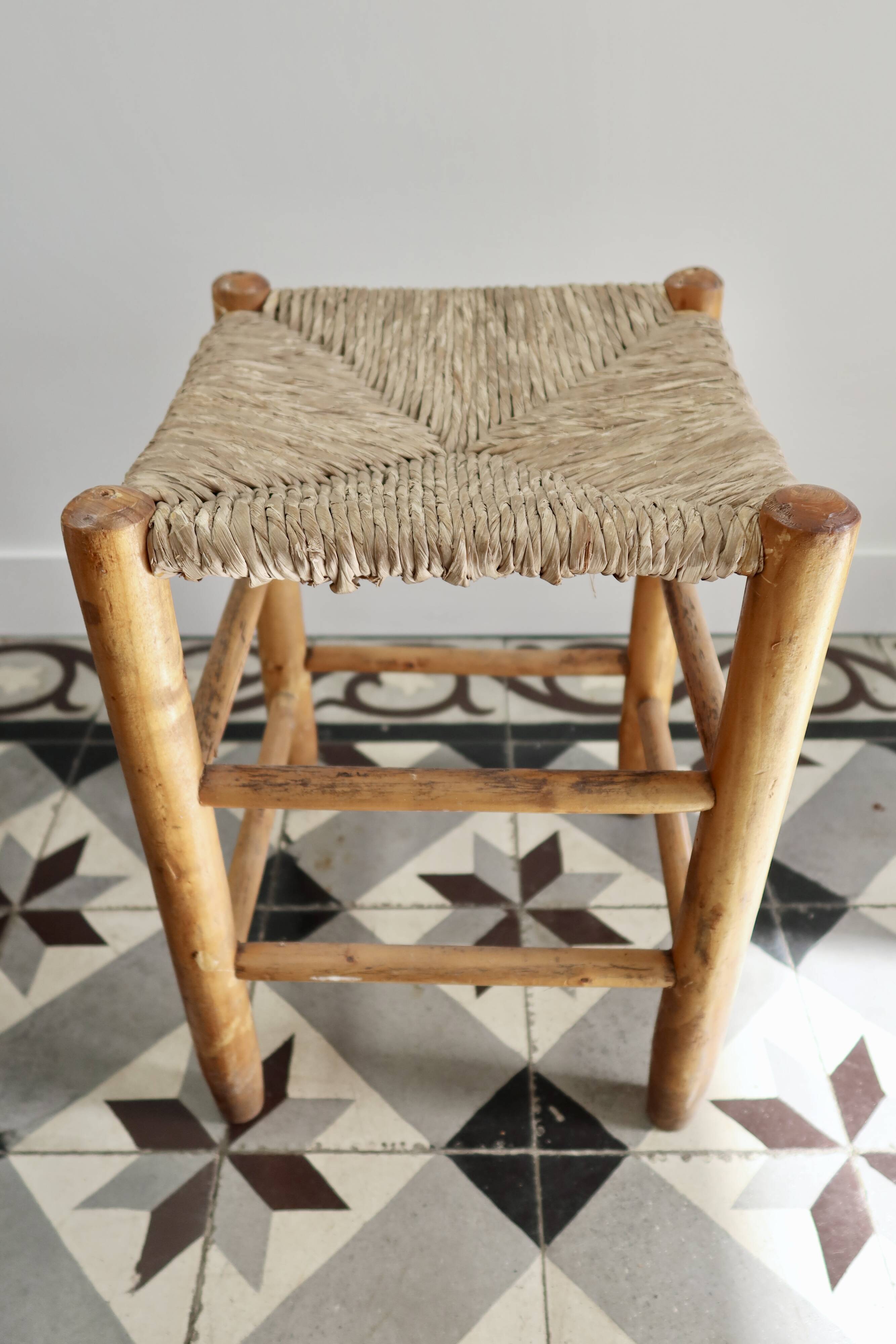 Vintage low stool in wood, honey yellow tones – Woven seat