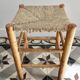 Vintage low stool in wood, honey yellow tones – Woven seat