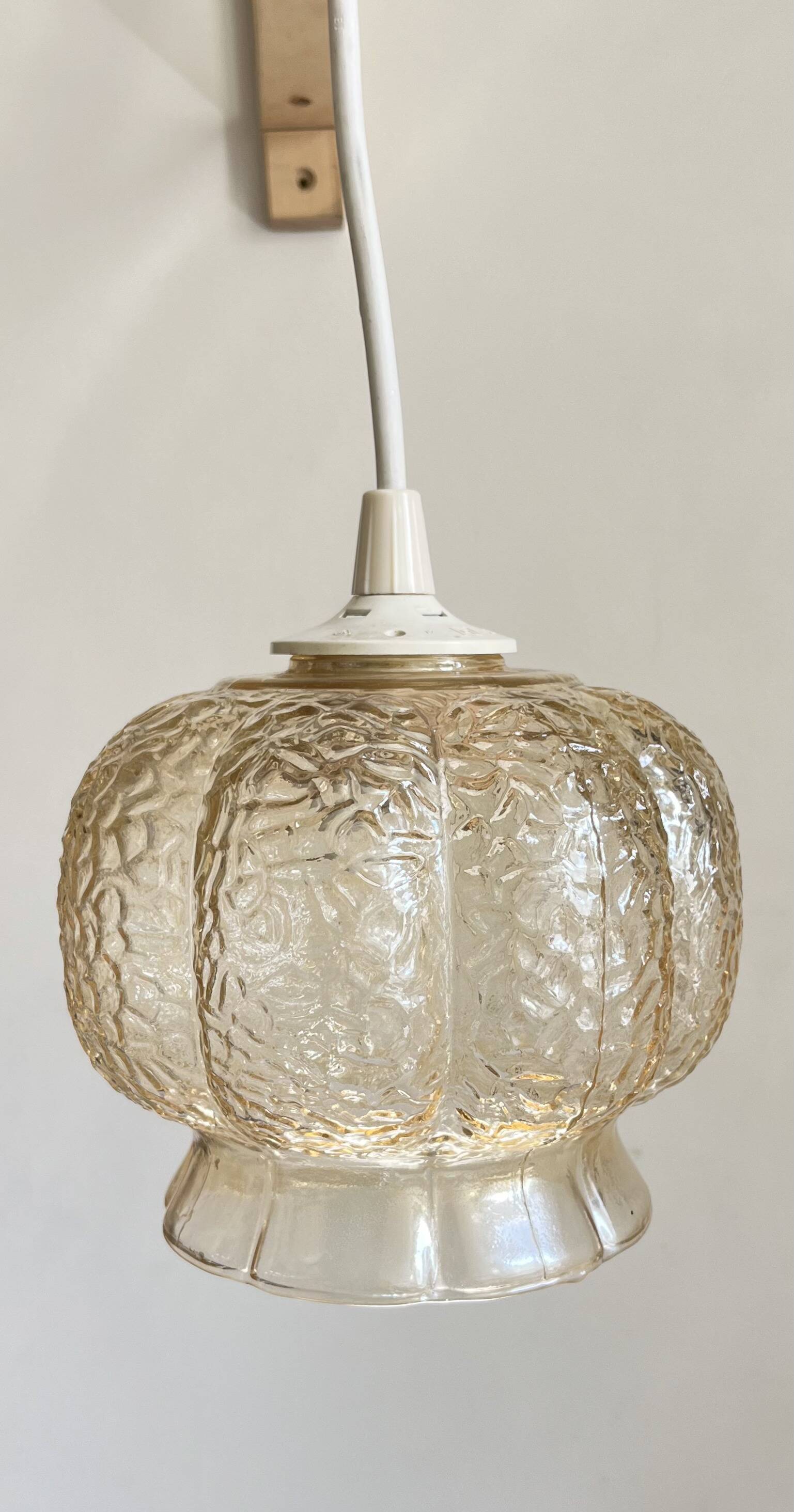 Small glass ball pendant light with amber plant effect