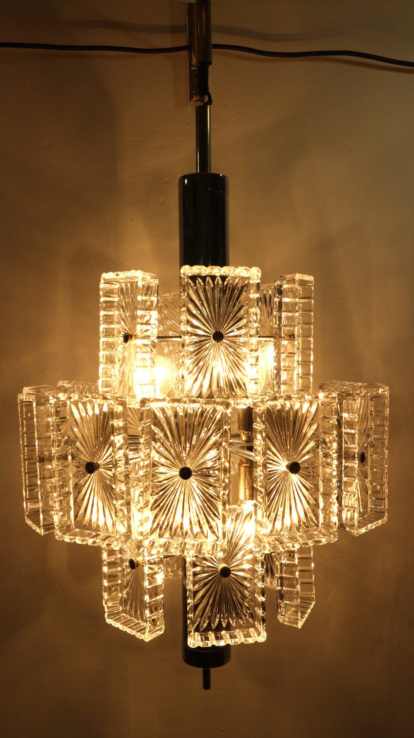 Vintage metal chandelier and carved glass
