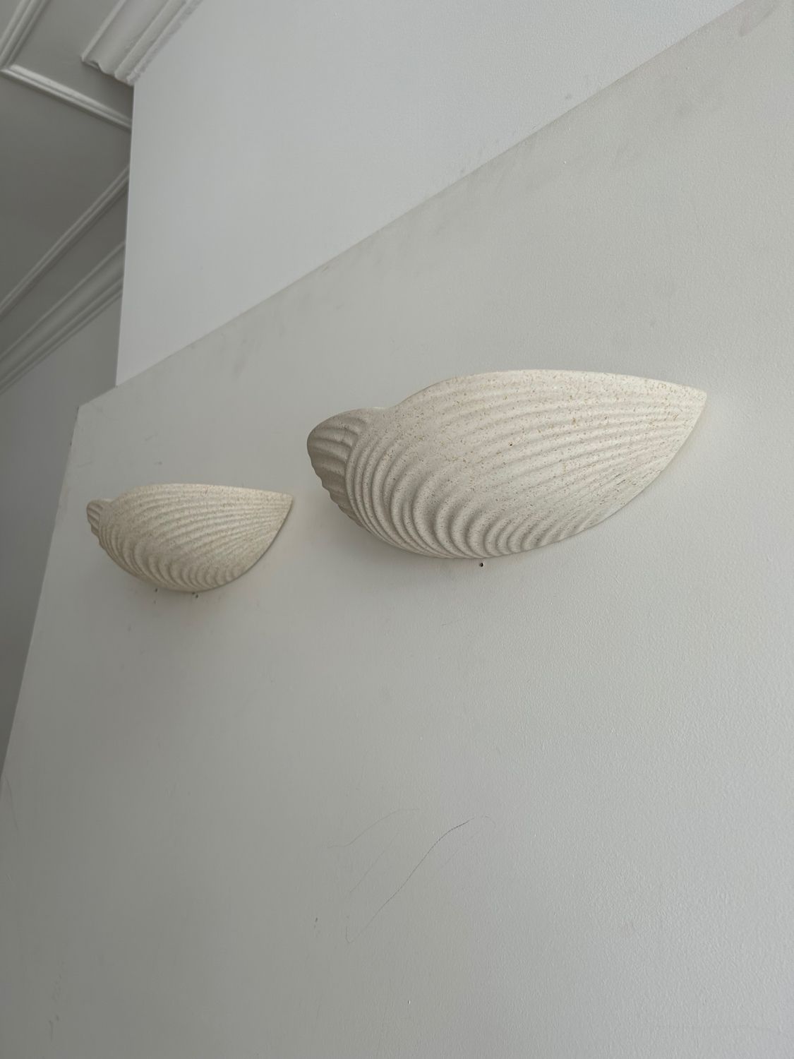 Pair of wall lamps in molded plaster France 1980