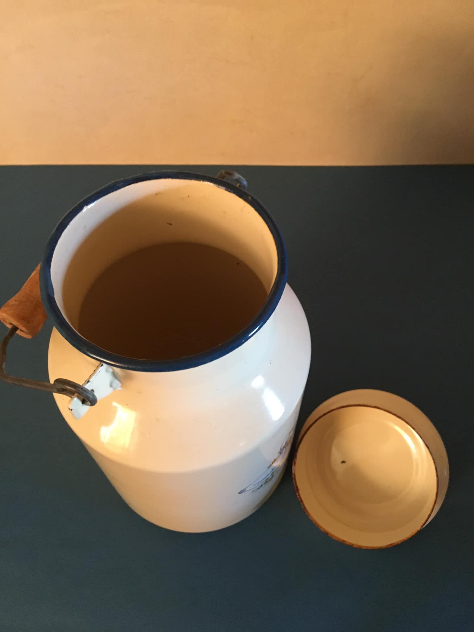 Enamelled milk jar retro style ecru color with "goose" patterns. Wooden handle.