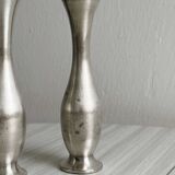 2 shiny metal vases