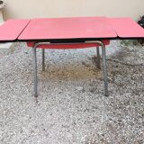 Table with two stools in red formica