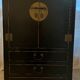 Asian-inspired black lacquered wooden wardrobe