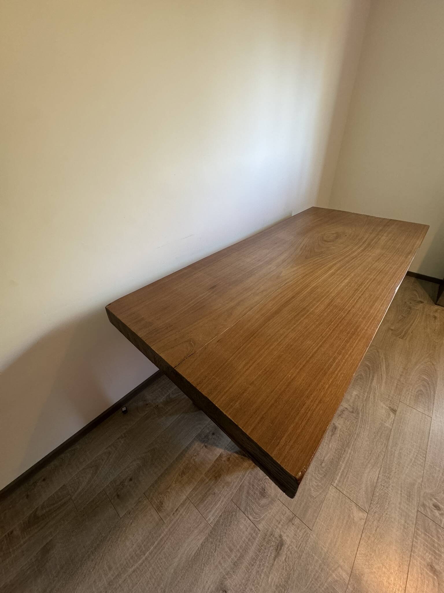 Industrial style table with a mahogany top.