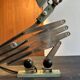 Old extendable accordion lamp in celadon green, workshop spirit.