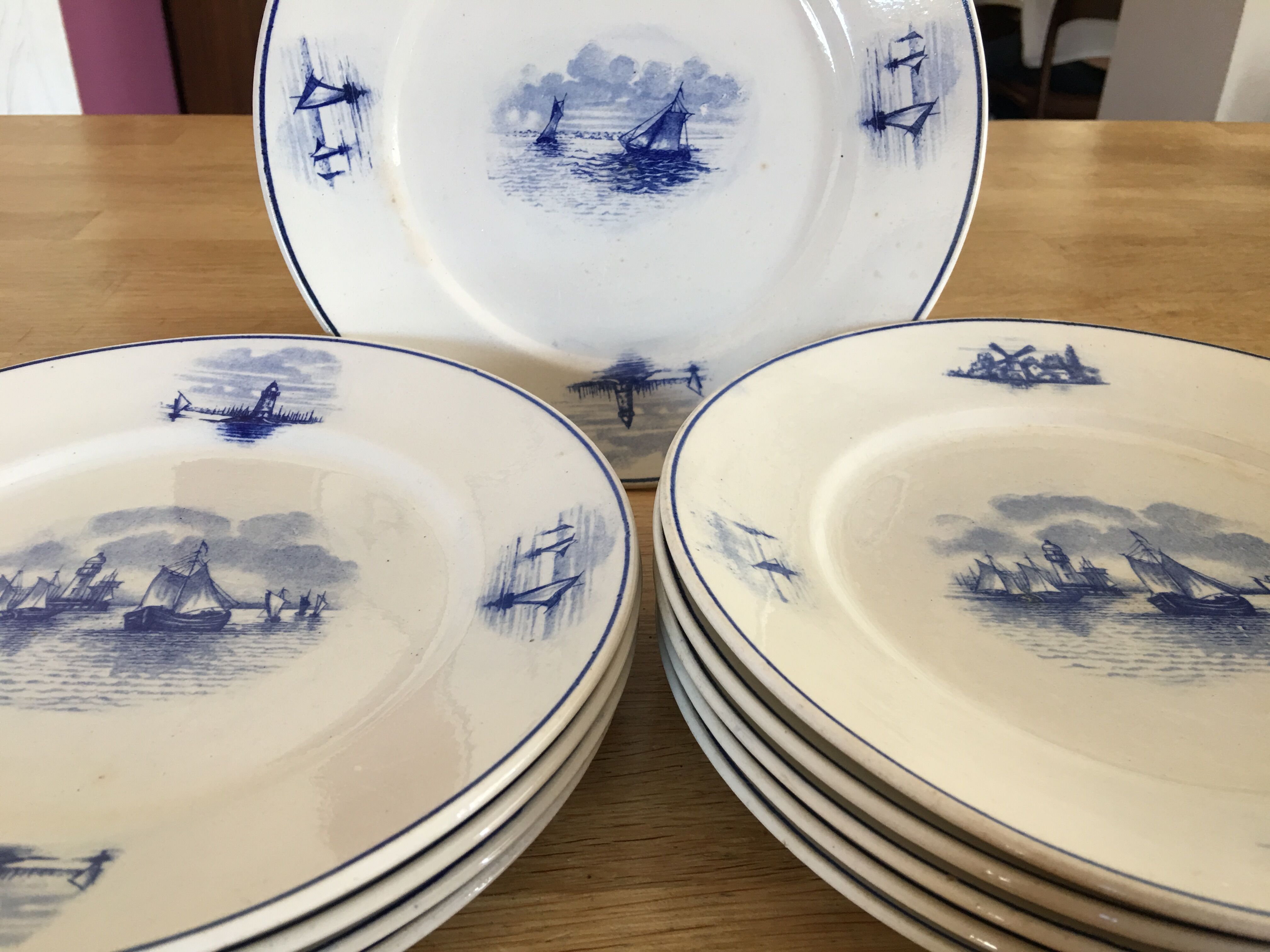 Series of 11 flat plates, Dutch earthenware, early XX
