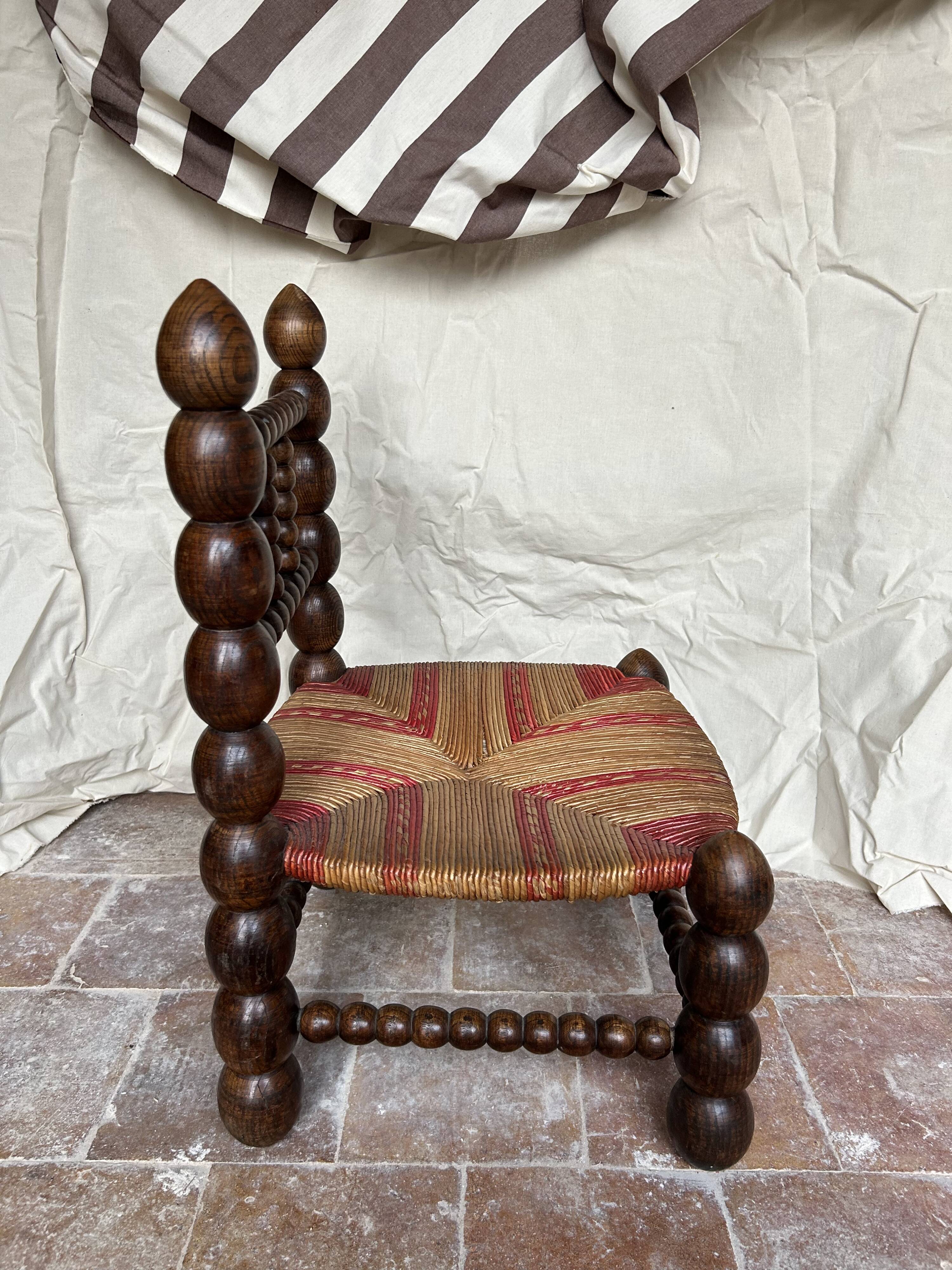 Turned wooden chair by Charles Dudouyt