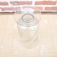 Ancient transparent glass vase with engraved plant decoration.