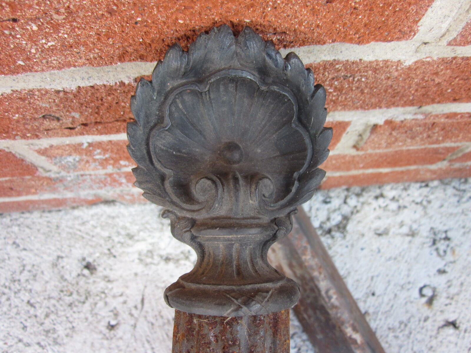 Pair of old cast-iron and bronze chenet