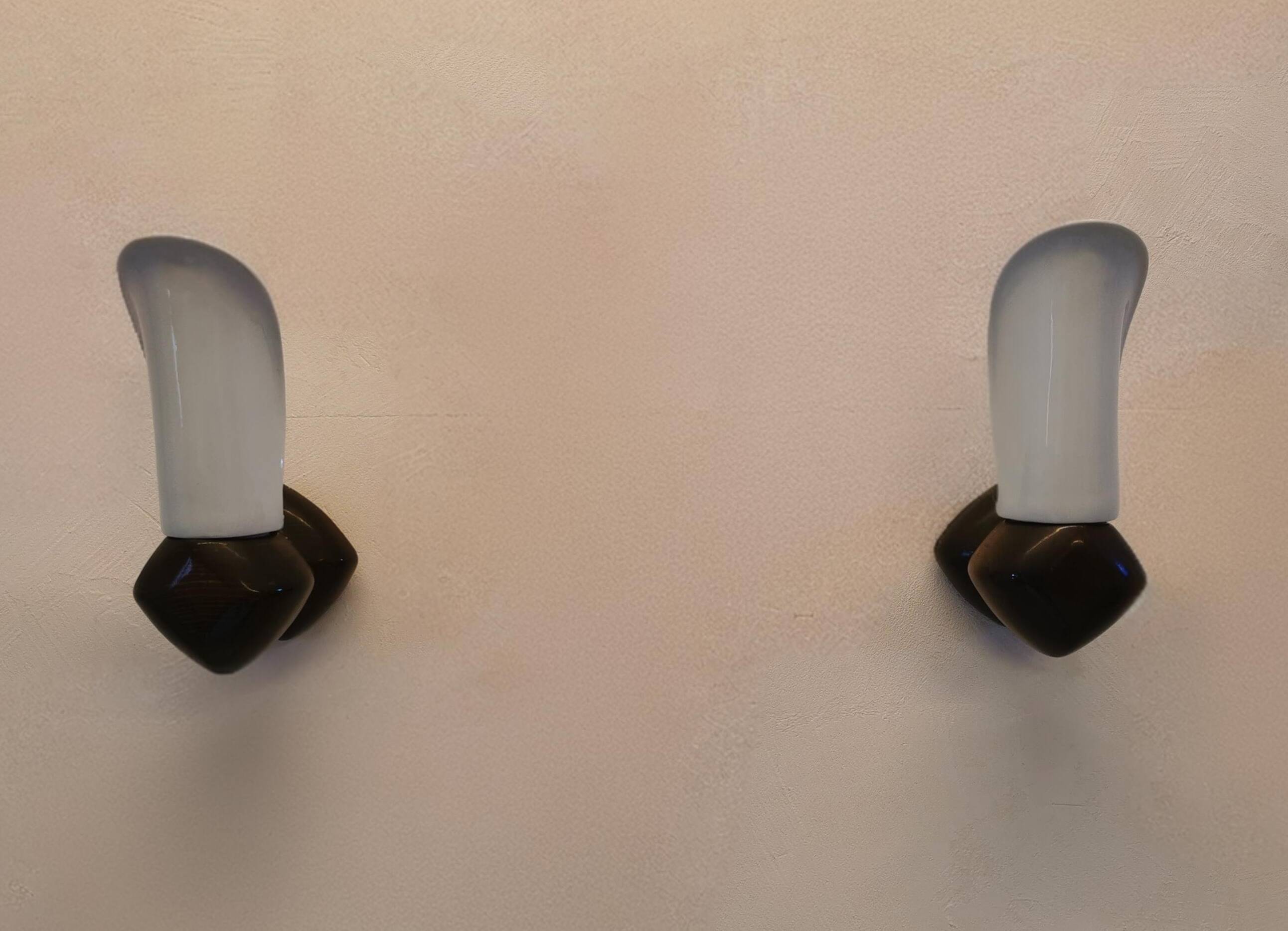 Pair of wood and earthenware sconces