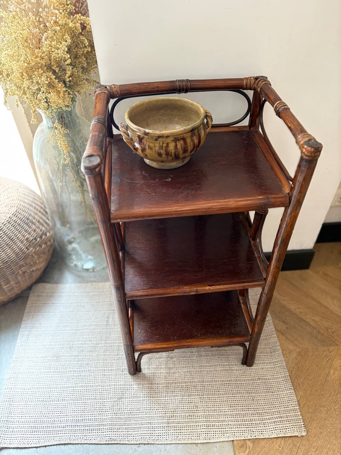 Dark brown 70s bamboo and cane shelf on legs