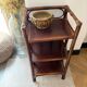 Dark brown 70s bamboo and cane shelf on legs